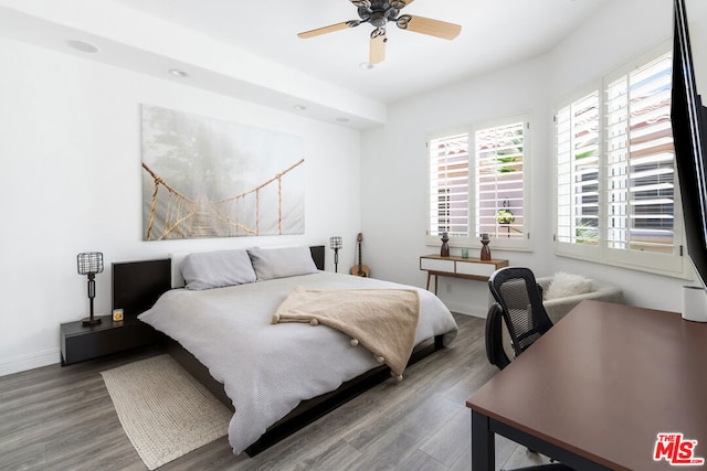 bedroom featuring wood-type flooring and ceiling fan