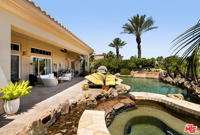 view of pool featuring a patio area and an outdoor living space