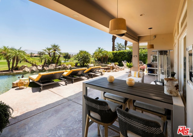 view of patio / terrace with a water view