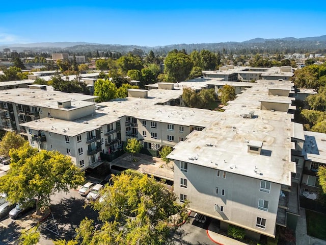 birds eye view of property with a mountain view