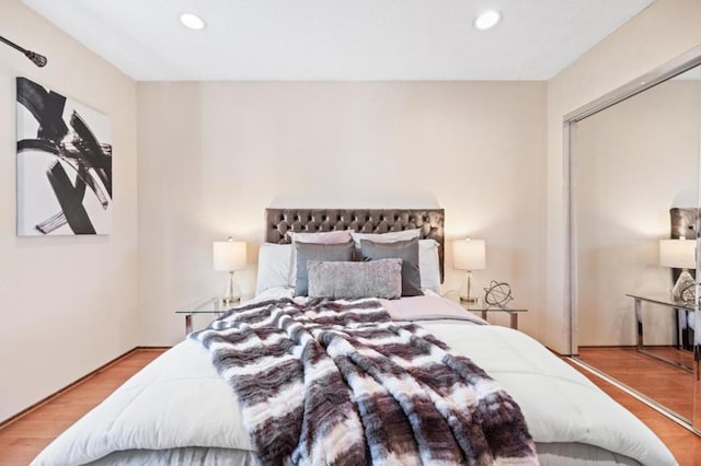 bedroom with a closet and light wood-type flooring