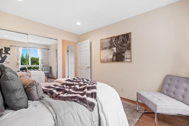 bedroom with hardwood / wood-style flooring