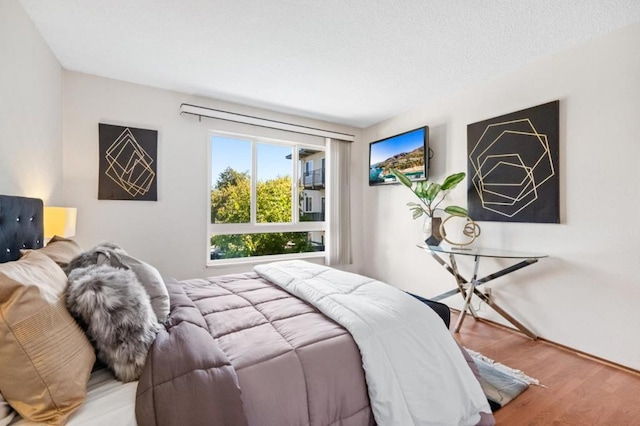 bedroom featuring hardwood / wood-style flooring