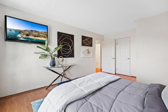 bedroom with hardwood / wood-style flooring