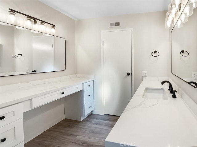 bathroom featuring hardwood / wood-style floors and vanity