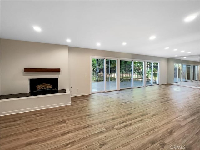 unfurnished living room featuring hardwood / wood-style floors