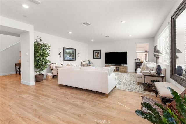 living room with light hardwood / wood-style floors