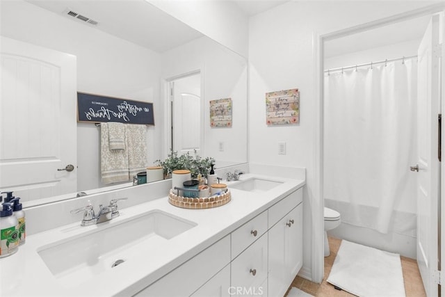 full bathroom featuring shower / bath combination with curtain, vanity, toilet, and tile patterned floors