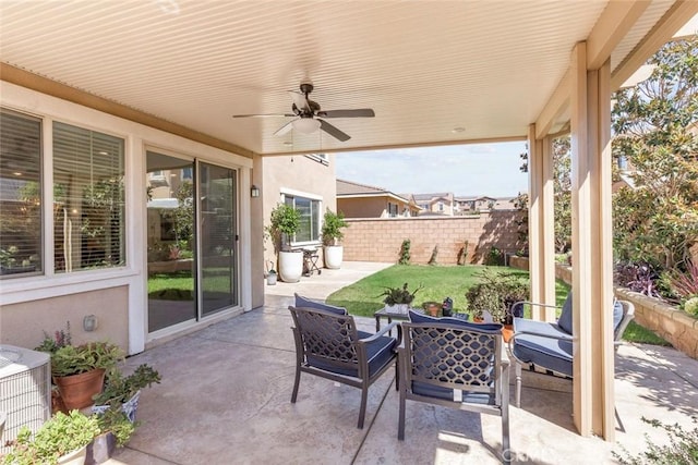 view of patio with central AC unit and ceiling fan