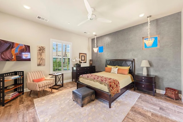 bedroom with hardwood / wood-style flooring and ceiling fan