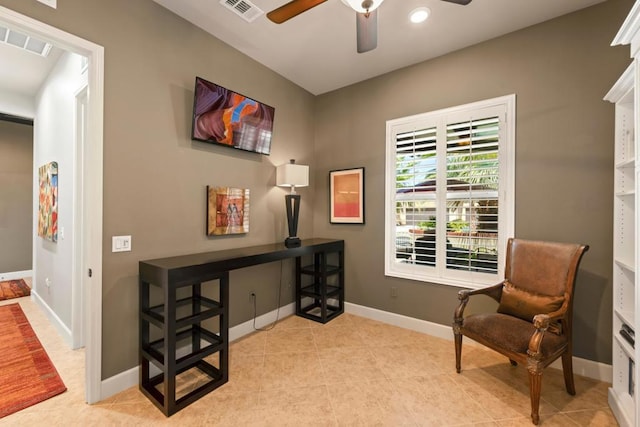 living area featuring ceiling fan