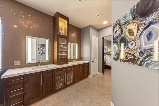 interior space featuring dark brown cabinetry and sink