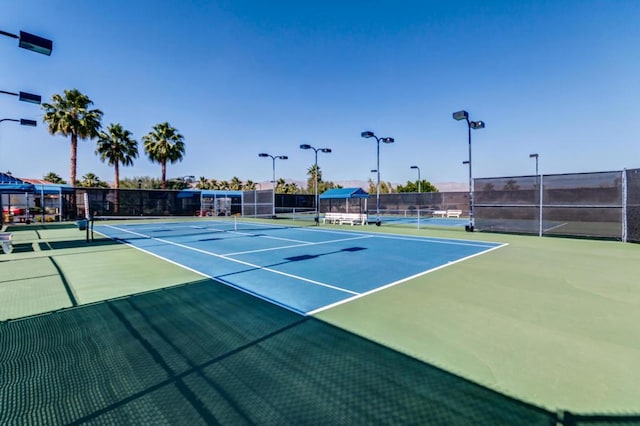 view of sport court with basketball hoop