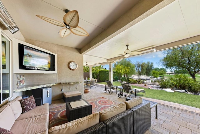 view of patio / terrace with ceiling fan and an outdoor hangout area