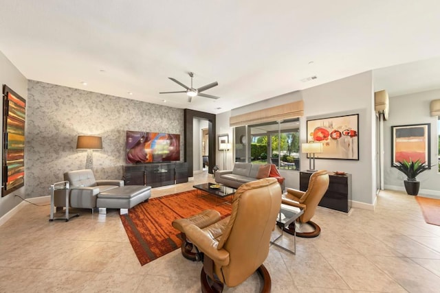 living room with ceiling fan and light tile patterned floors