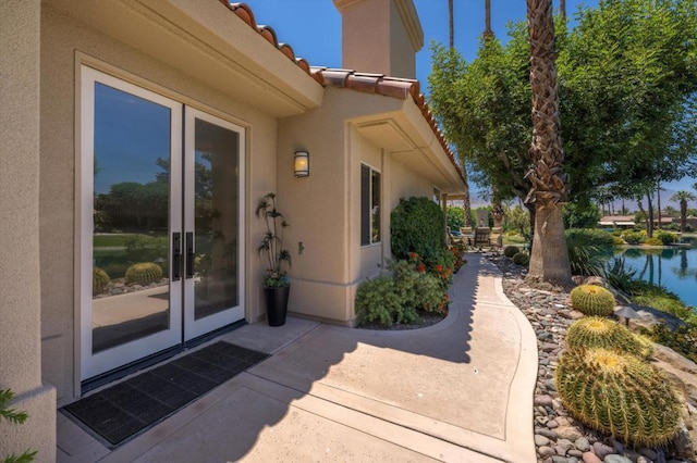 property entrance with a water view