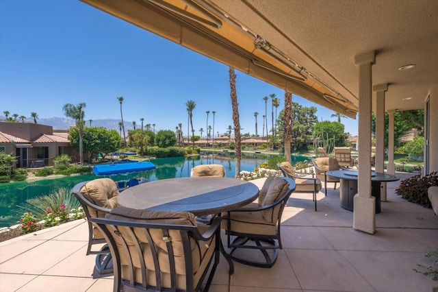 view of patio featuring a water view