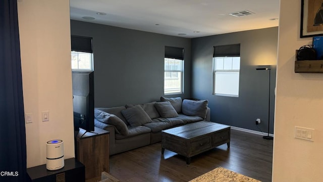 living room with dark hardwood / wood-style flooring