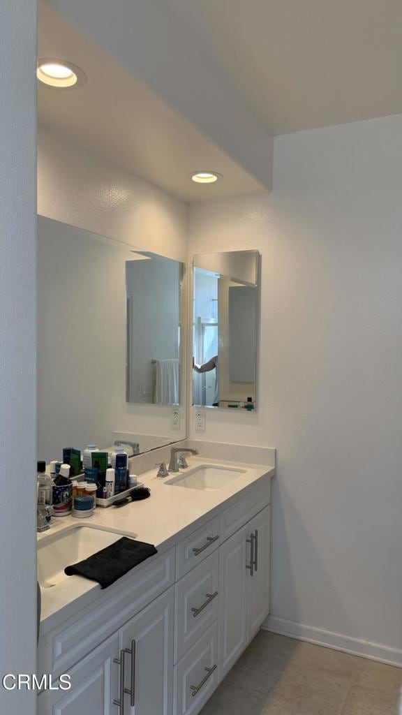 bathroom featuring tile patterned floors and vanity