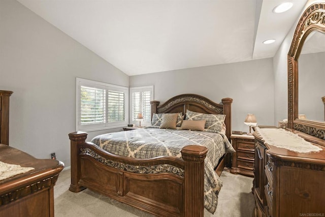 carpeted bedroom featuring lofted ceiling