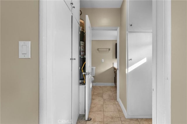 corridor with light tile patterned flooring