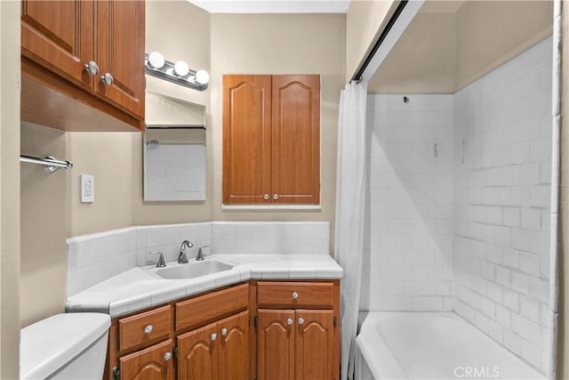 full bathroom featuring vanity, toilet, and shower / bathtub combination with curtain