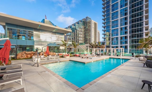 view of swimming pool featuring a patio area