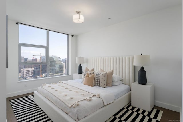 bedroom featuring dark wood-type flooring