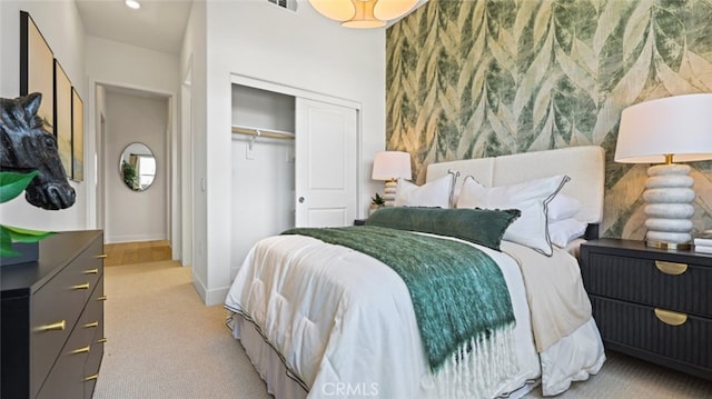 carpeted bedroom featuring a closet