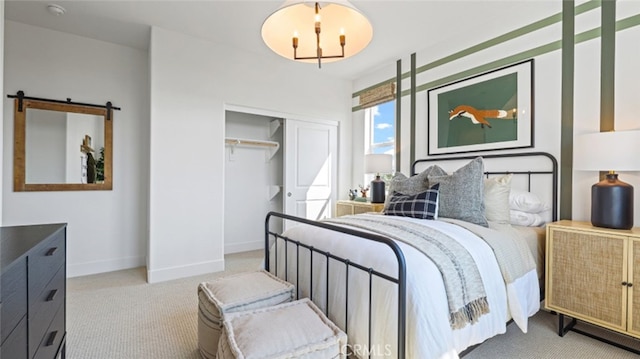 bedroom featuring light colored carpet, an inviting chandelier, and a closet