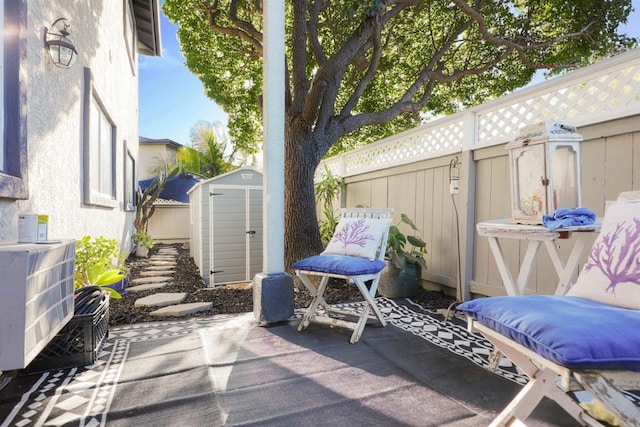 view of patio featuring a storage unit