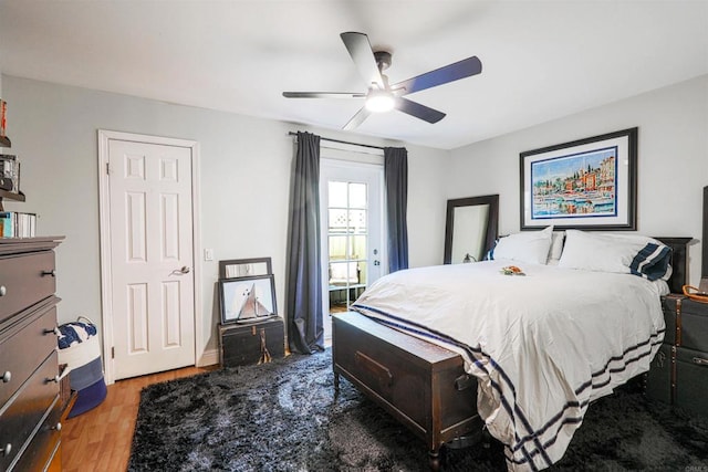 bedroom with ceiling fan and hardwood / wood-style floors