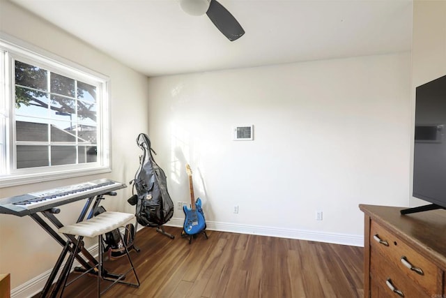 miscellaneous room with dark wood-type flooring and ceiling fan