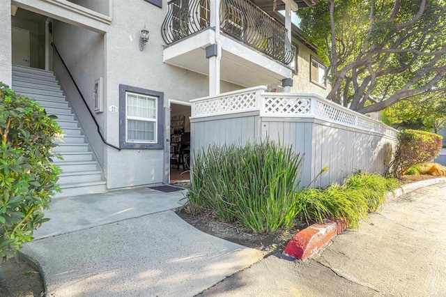 property entrance with a balcony