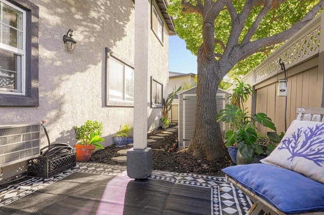 view of patio / terrace featuring a storage shed