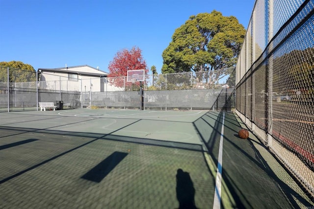 view of tennis court with basketball court