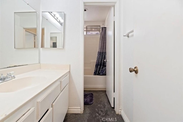 bathroom featuring vanity and shower / bathtub combination with curtain