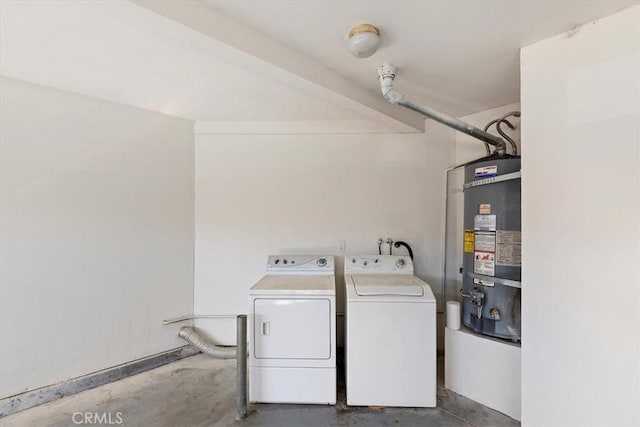 clothes washing area with washer and dryer and strapped water heater