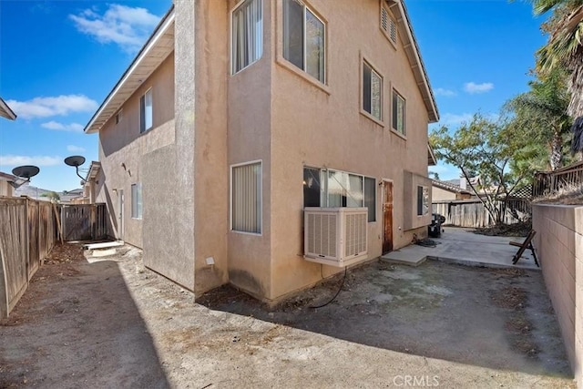 view of side of home featuring a patio area