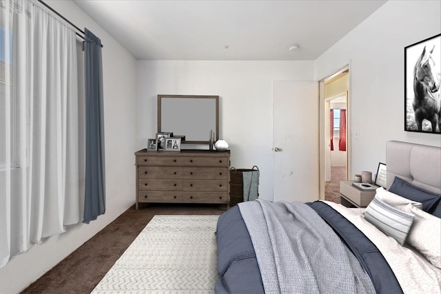 bedroom featuring dark colored carpet