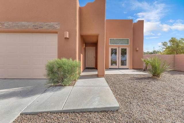 view of exterior entry featuring a garage