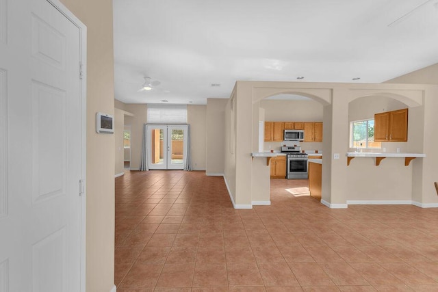 interior space featuring plenty of natural light and light tile patterned flooring