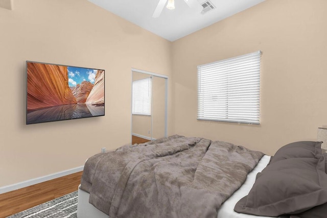 bedroom with hardwood / wood-style floors and ceiling fan