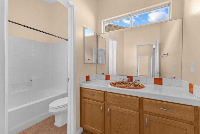 full bathroom featuring tile patterned flooring, vanity, bathing tub / shower combination, and toilet