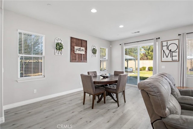 dining area with light hardwood / wood-style flooring