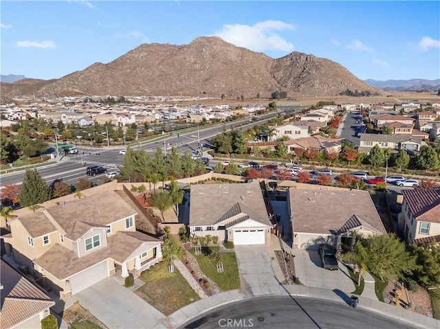 birds eye view of property featuring a mountain view