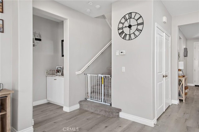 stairway with hardwood / wood-style floors