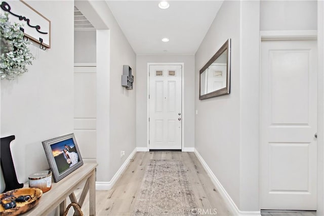 doorway to outside with light hardwood / wood-style flooring