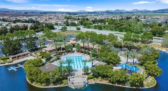 drone / aerial view with a water and mountain view