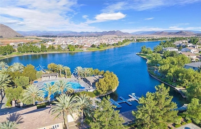 bird's eye view with a water and mountain view